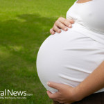 Pregnant-Woman-Caressing-Her-Huge-Belly-At-Open-Air
