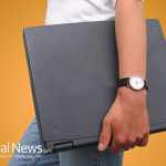 Woman-Holding-Closed-Laptop-Computer
